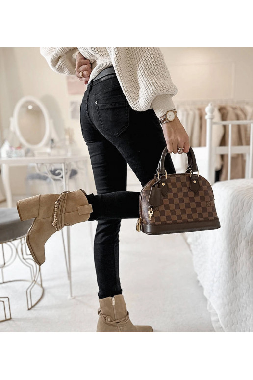 Mustast kangast püksid Sylvaini vööga