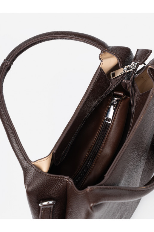   Käekott z kosmetyczką środku