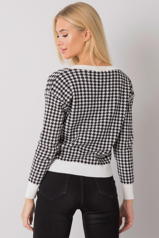 Valge ja must nööbitav kampsun...