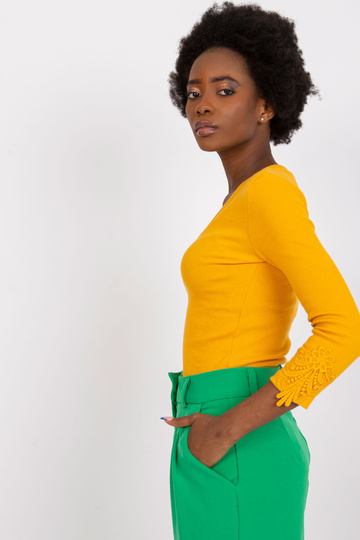 Heleoranži triibuline pluus...