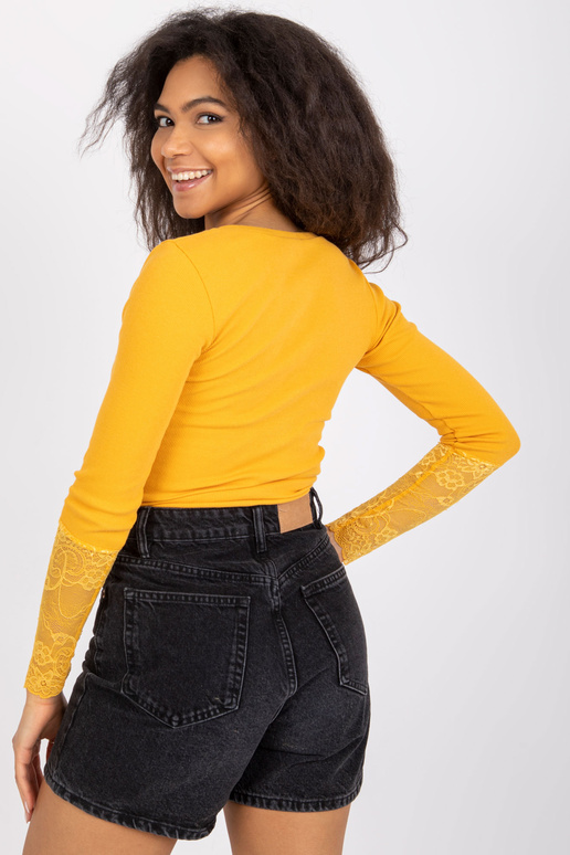 Pitsiga heleoranž soonikpluus...