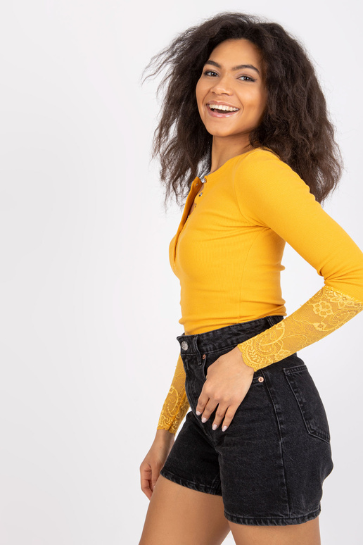 Pitsiga heleoranž soonikpluus...