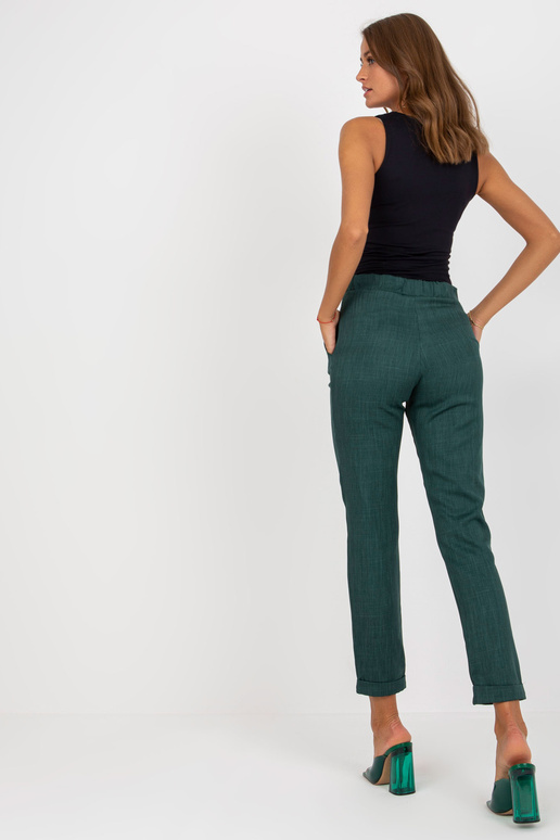 Tumerohelised elegantsed riidest püksid