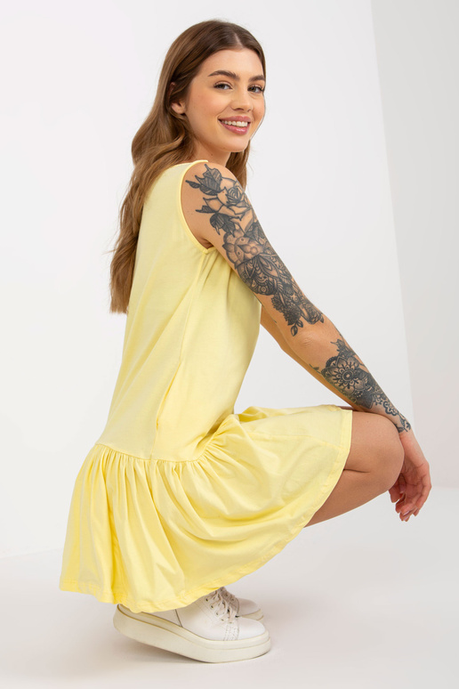 Kollane mini, põletatud volangidega...