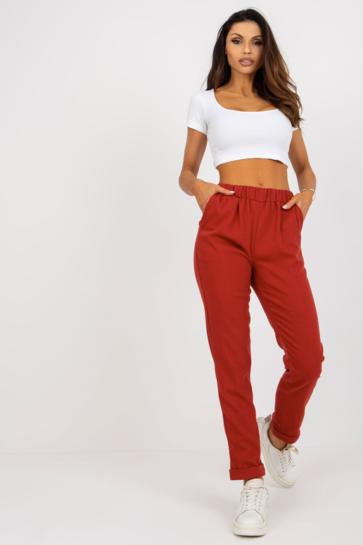 Tumeoranžist kangast taskutega püksid